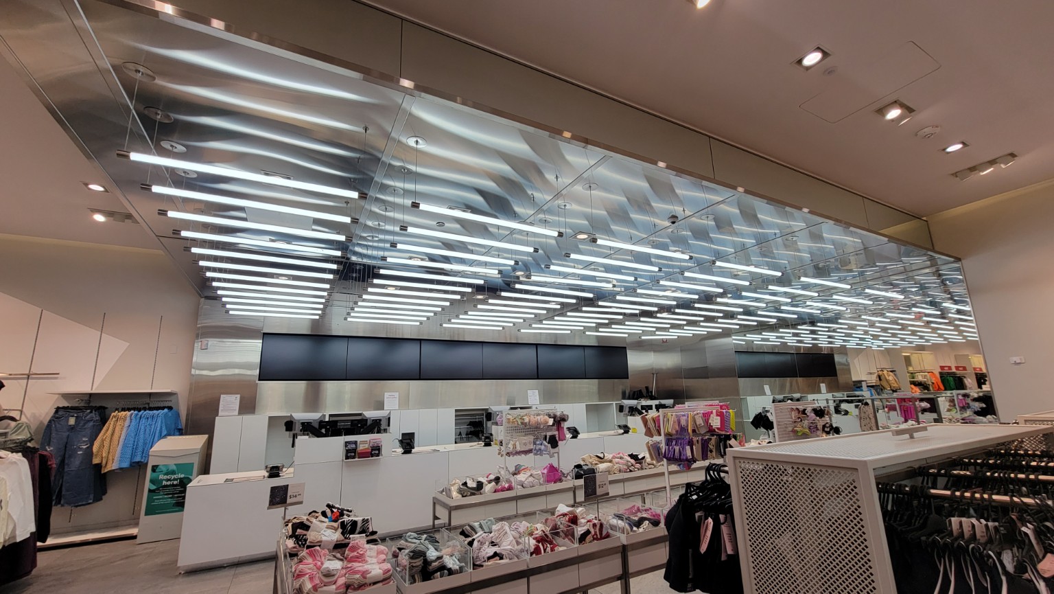 Suspended linear lighting in a retail space